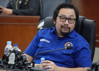 Erwinsyah Ismail, S.I.Kom, M.I.Kom